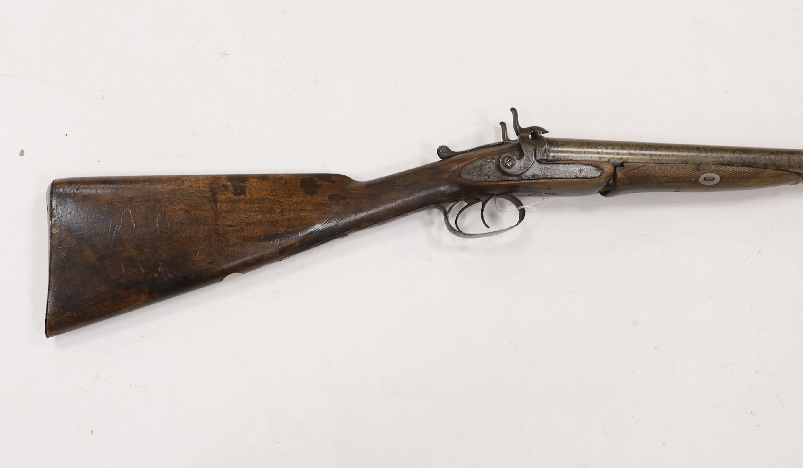 A double barrel pinfire shotgun by Wesley Richards with patent knuckle joint and top lever, barrels 74.5cm